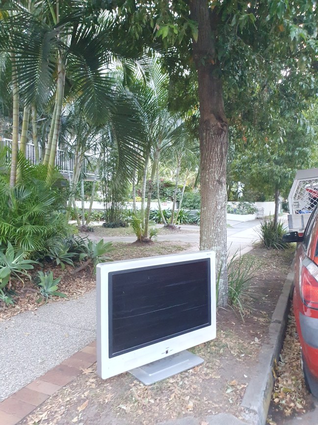 Discarded TV on the footpath